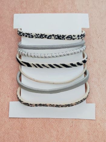 Lot 7 élastiques motif animal noir crème argent