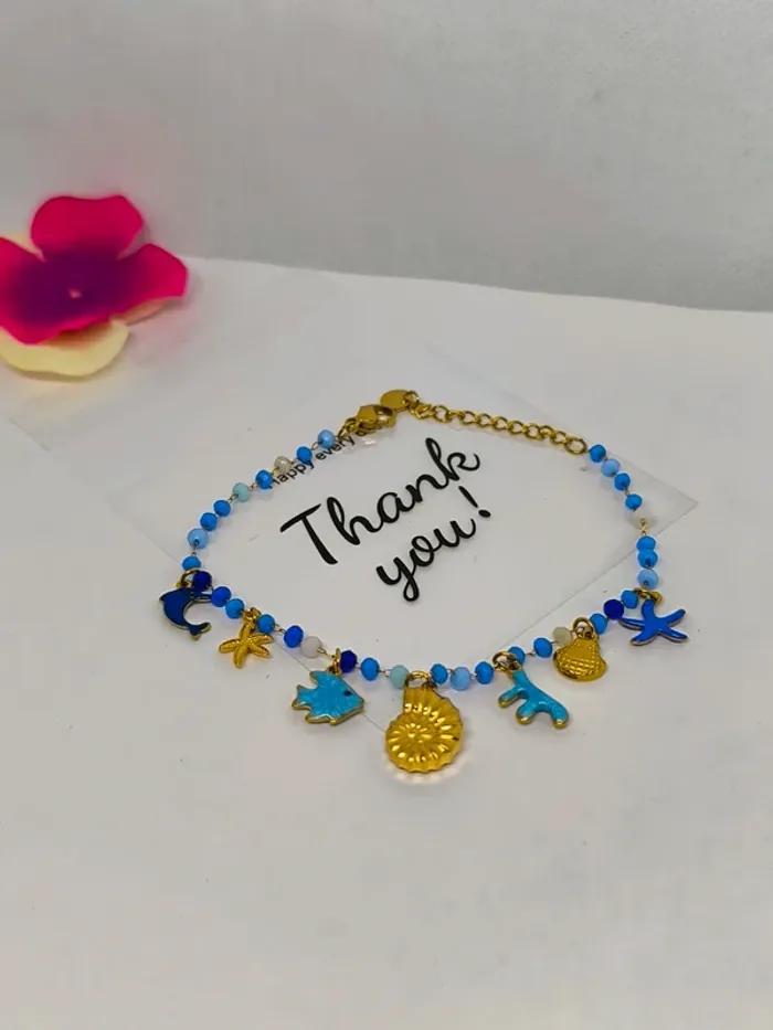 Bracelet doré et bleu avec perles de cristal et breloques de la mer - photo numéro 5