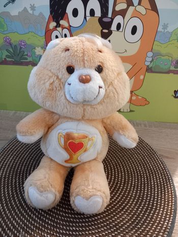Peluche care bears vintage champion Kenner 1985  mesure 34cm 
