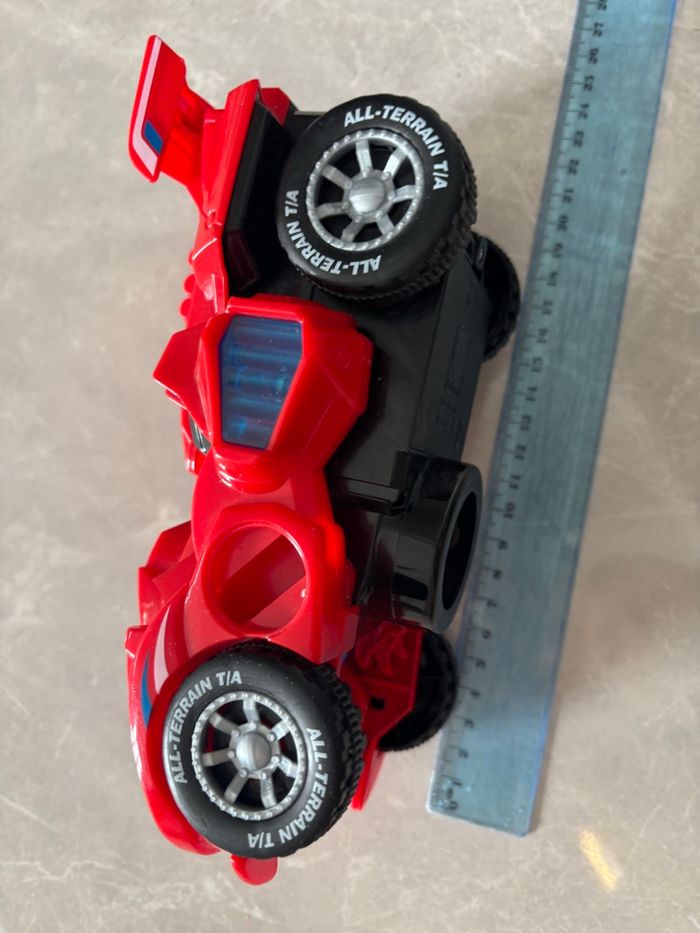 Jouet dinosaure /voiture qui se transforme avec sons et lumière avance seule rouge - photo numéro 9