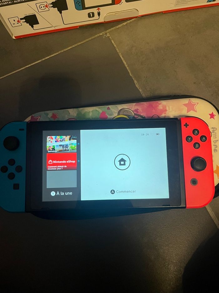 Nintendo switch + boite d’origine + chargeur + joycon - photo numéro 2