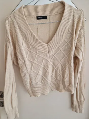 Pull beige col v à motif losange taille M