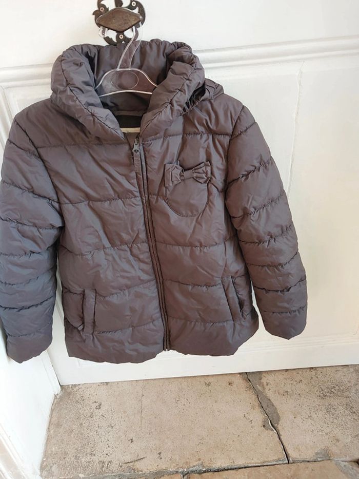 Parka fille DPAM 10 ans en  très bon état .