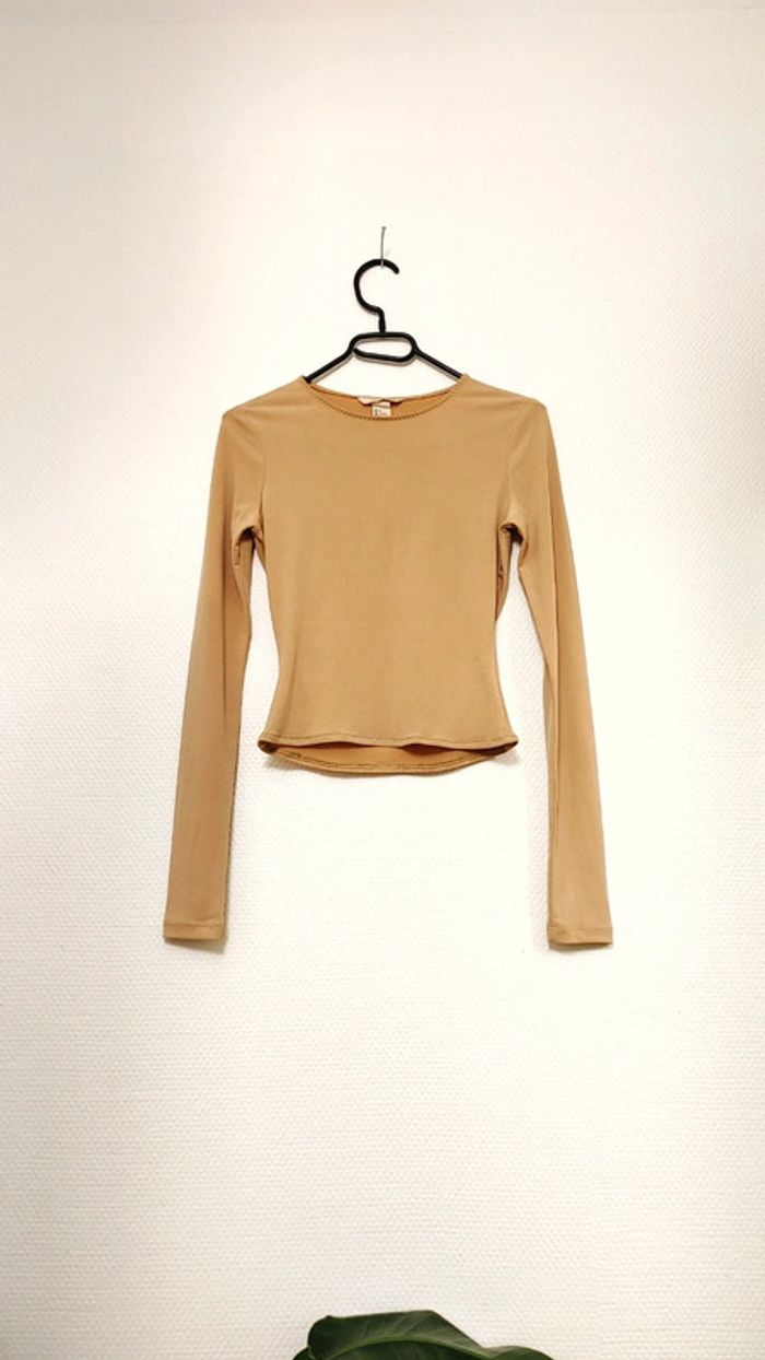 Haut court moulant manche longue beige 34 très bon état HM