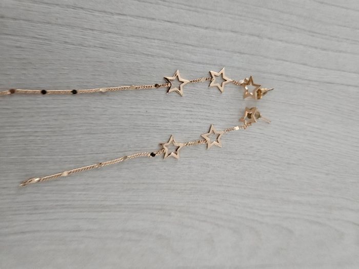 Boucle d'oreille pendante étoiles