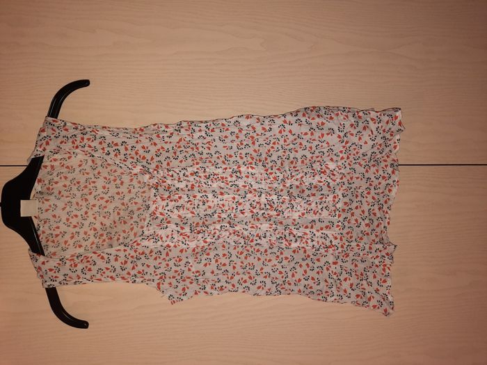 Blouse motifs noirs et oranges taille S