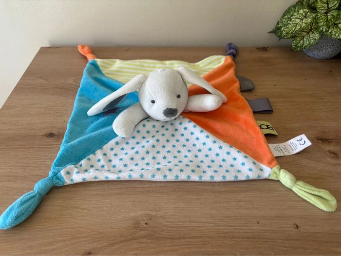 Doudou plat lapin bleu orange étoiles obaibi