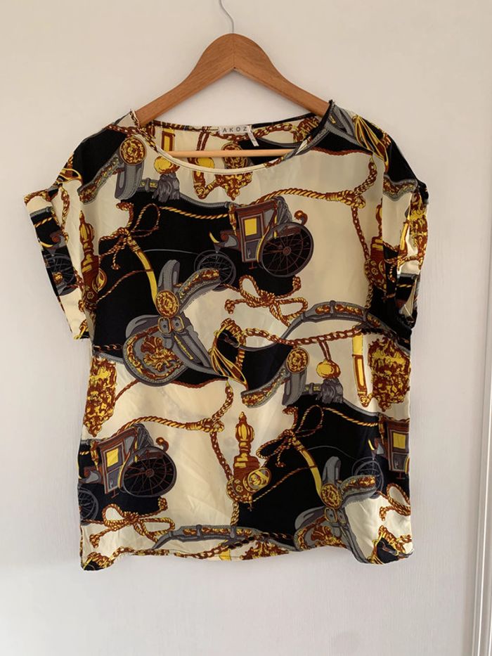 Blouse beige et noir à motifs