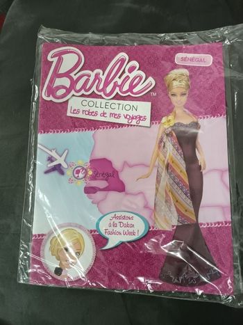 Robe de mes voyages barbie et livre neuf .