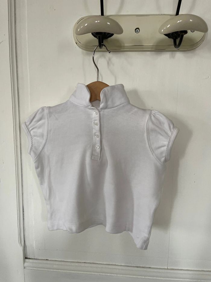 Polo blanc, kid kanaï