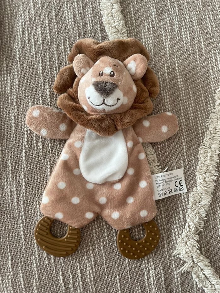 Peluche doudou plat d’éveil 25cm action lion marron pois blanc parfait état