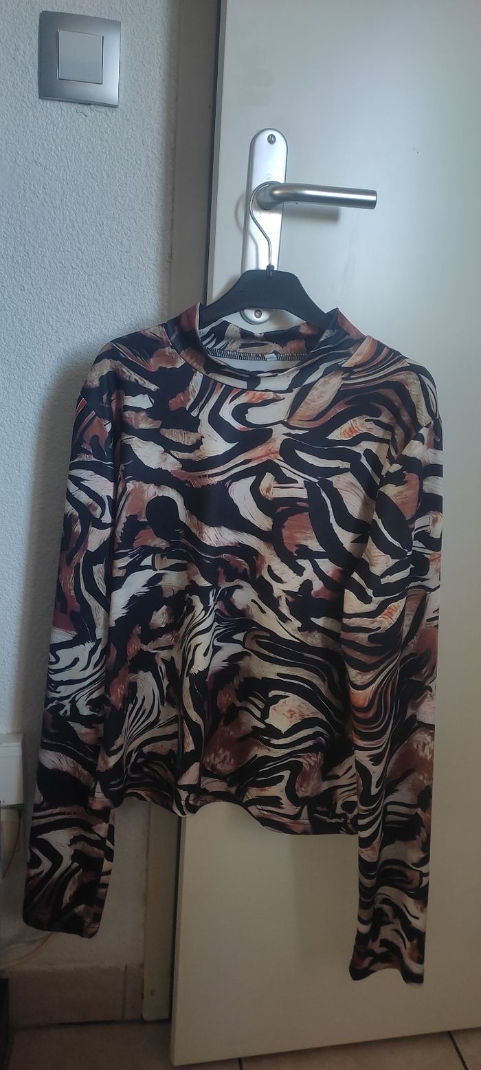 Joli haut seyant Taille L