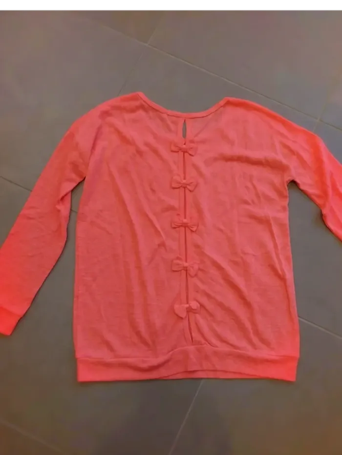 Haut rose avec noeud dans le dos TU