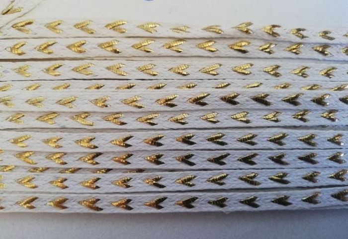 24m85 de ruban blanc doré