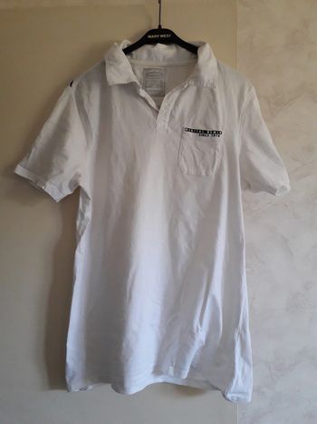 polo blanc et noir OWK taille M
