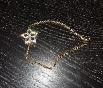 Bracelet fantaisie maille dorée avec fleur