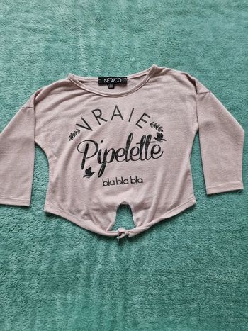 Très joli haut pailleté 2 ans