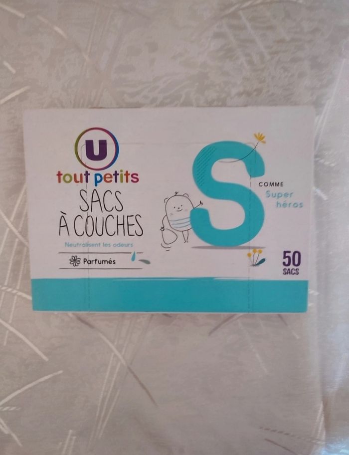 Paquet de 39 couches taille 5 marque mots d'enfants avec boîte de 50 sacs a couches parfumés - photo numéro 4