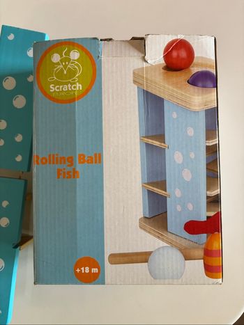 Jouet bois bébé Rolling ball fish scratch
