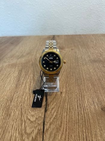 Montre homme élégante acier & doré – style luxe avec date