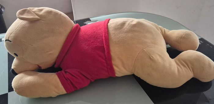 Winnie L'ourson allongé