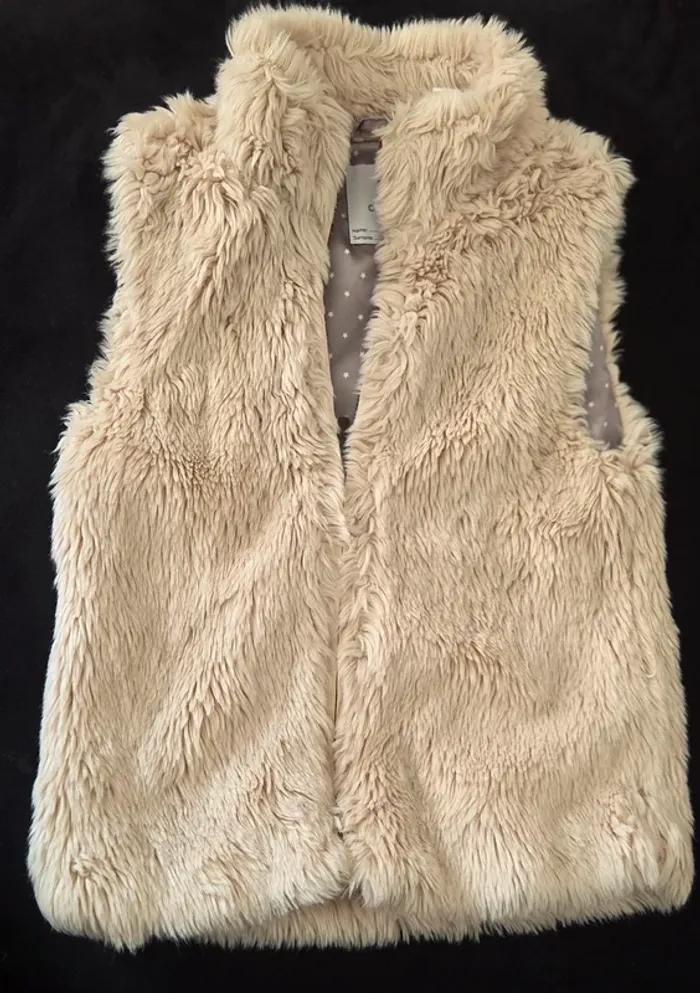 Gilet sans manche T.8 ans