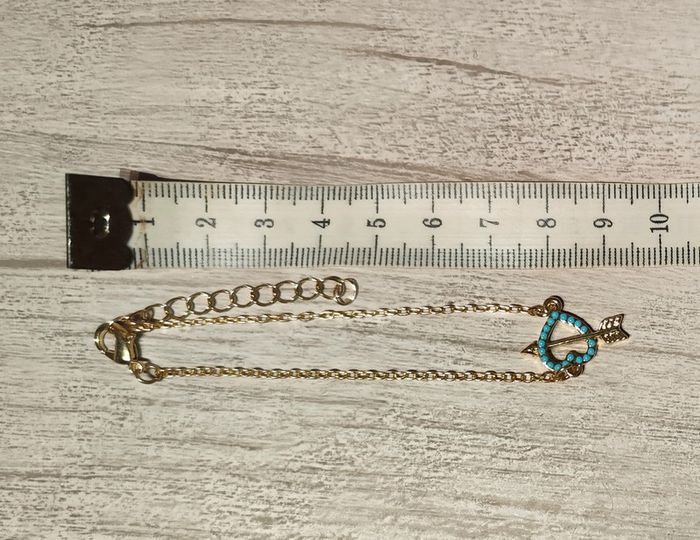Bracelet doré avec breloque cœur bleu turquoise percé d'une flèche ajustable - photo numéro 2