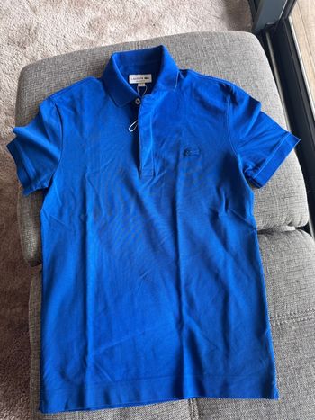 Polo Lacoste bleu neuf
