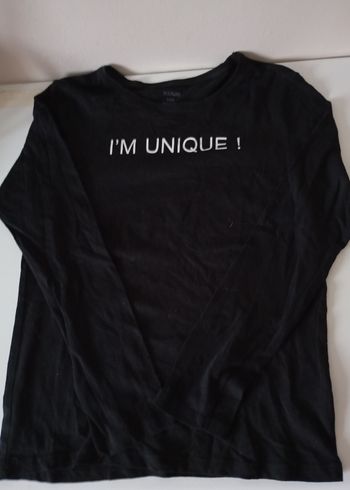 Tee-shirt noir ,10 ans ,manches longues,coton ,écriture blanche. Kiabi . État neuf.