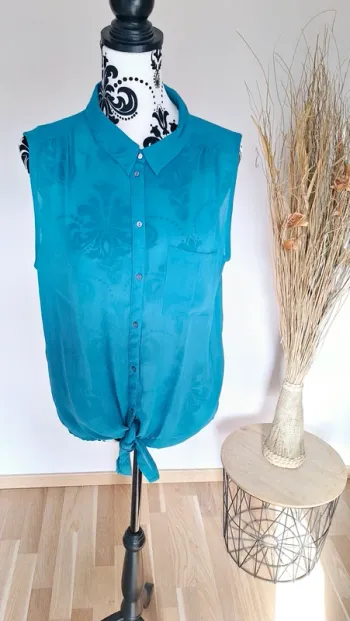 Sublime blouse turquoise sans manches en excellent état
