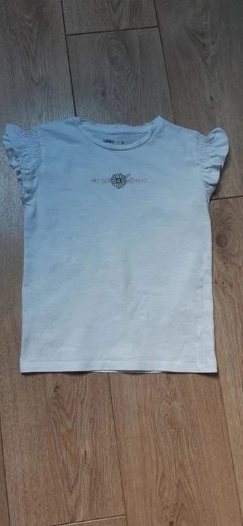 Tee-shirt Mc volantées blanc "passionnément" 8 ans en très bon état