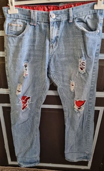 Jeans à trous taille 44 mixte