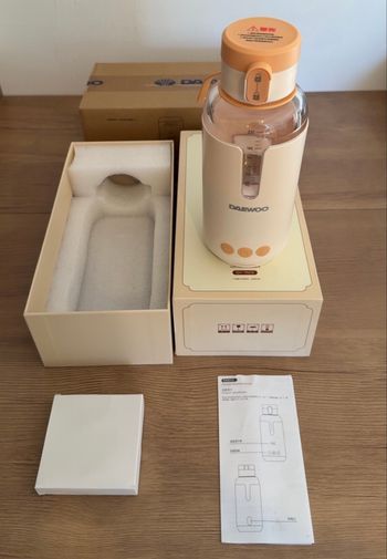 Chauffe biberon portable eau lait neuf emballé jamais utilisé (2 couleur disponible )