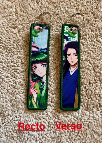 Un porte clés brodé  « Les carnets de l’apothicaire » neuf 