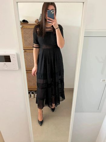 Longue robe noire ajourée Sandro