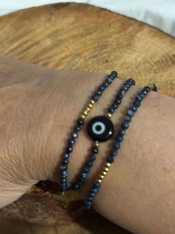 Bracelet multi rangs perles noires or œil acier inoxydable réglable