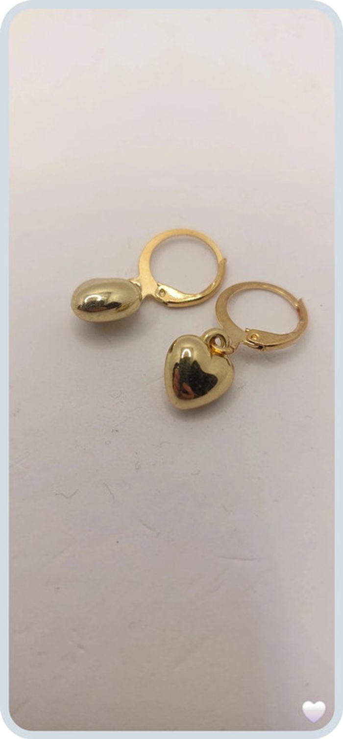 magnifique boucles d oreilles en acier dorée