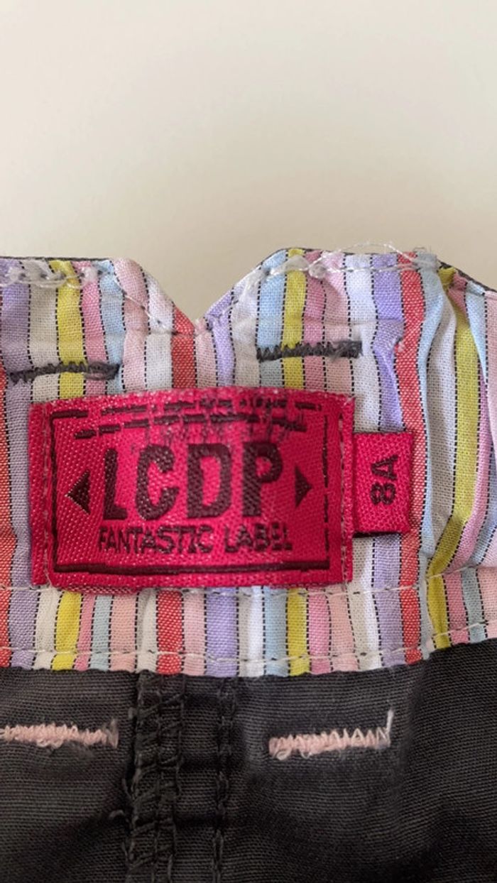 LCDP. Jupe courte été grise brillante. 8ans. - photo numéro 7