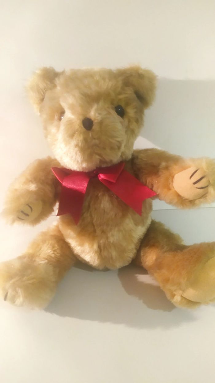 jolie nounours articulable noeud rouge