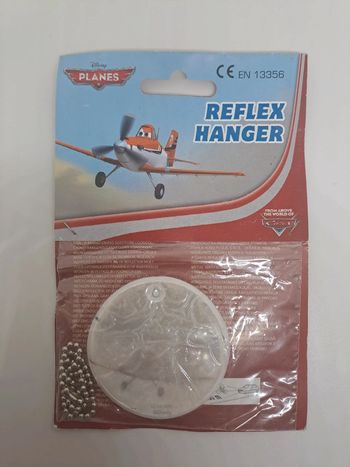 Porte-clés réfléchissant, Planes.
Diamètre : 5,5cm.
NEUF.