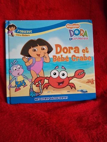 Livre dora et bébé crabe