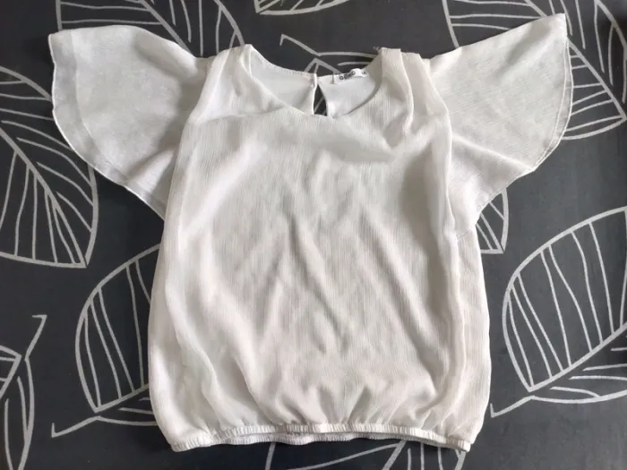 Joli haut / blouse manches courtes scintillant fille Gemo 8 ans