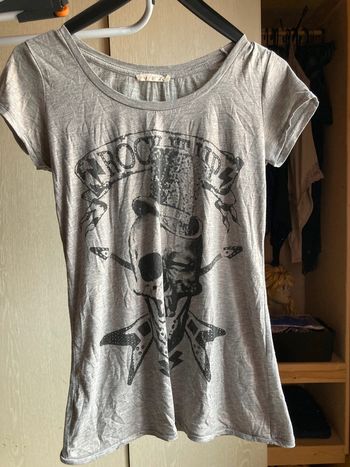 Superbe t-shirt rock avec tête de mort tissu brilliant doré taille M
