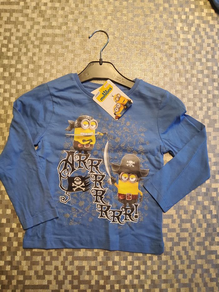 🍌 T-shirt enfant Minions – bleu, manches longues, “Ahoy There!”
🆕 Article neuf avec étiquette T 8 ans