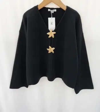Pull noir étoiles dorées été laine tendance