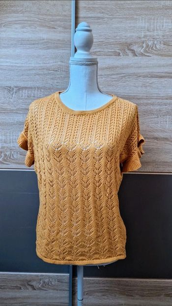 Haut maille ajourée.