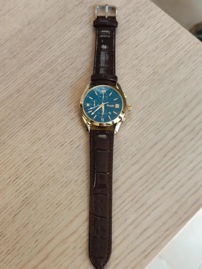 Montre marron, dorée, arrondie à reflets bleus - photo numéro 4