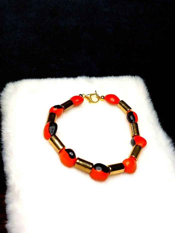 Magnifique bracelet en perles couleur doré et orange. - photo numéro 2