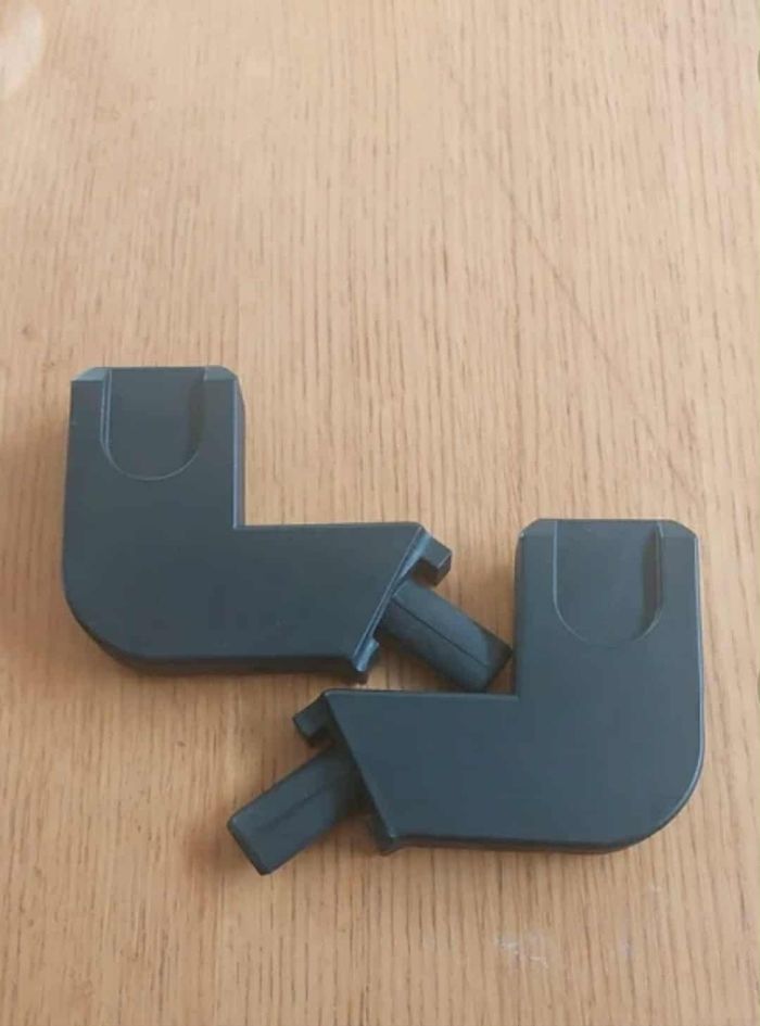 Adaptateur fixation poussette