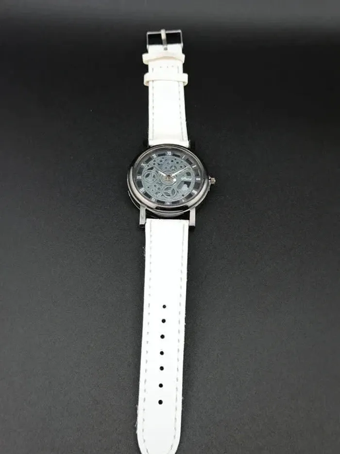 Montre blanche, mécanique argentée apparente - photo numéro 3